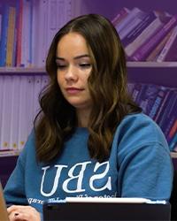 Laura Cook working on a computer